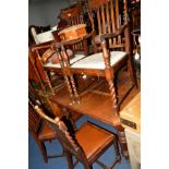 AN EDWARDIAN OAK WIND OUT DINING TABLE with two additional leafs, extended width 215cm x closed