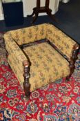 AN EDWARDIAN MAHOGANY ARMCHAIR, of a square form and turned front supports, covered in floral and