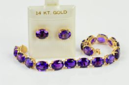 AN AMETHYST BRACELET AND EARRINGS, the bracelet designed as oval amethysts links, within four claw