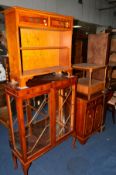A CHERRYWOOD GLAZED TWO DOOR DISPLAY CABINET, a yew wood open bookcase, two door hi fi cabinet and