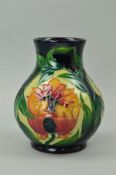 A MOORCROFT POTTERY VASE, 'Fire Flower' pattern on dark ground, impressed and painted marks and '