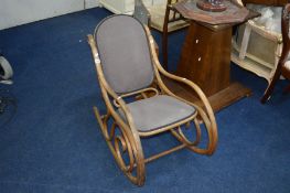 AN OAK FRAMED BENTWOOD ROCKING CHAIR