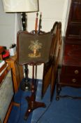 A VICTORIAN ROSEWOOD POLE SCREEN, the panel with needlework decoration depicting still life,