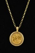 A 9CT GOLD SOVEREIGN PENDANT, the Edward VII 1909 half sovereign within a diamond cut and rope twist