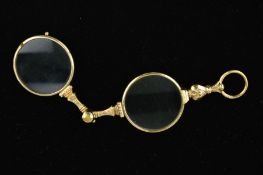 A PAIR OF EARLY 20TH CENTURY GOLD PLATED CENTURY LORGNETTES with spring release mechanism,