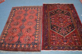 A 20TH CENTURY AFSHAR RUG, red and blue ground, 194cm x 121cm, together with another similar rug,