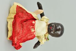 A COMPOSITION HEADED TOPSY-TURVY DOLL, nape of one neck marked 'BA/L Made in England', moulded hair,