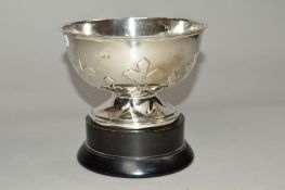 A GEORGE V SILVER CIRCULAR ROSE BOWL, repousse leaf decoration to lower sides, on a circular foot (