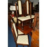 A SET OF SIX EARLY 20TH CENTURY OAK DINING CHAIRS