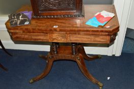 A REGENCY MAHOGANY AND ROSEWOOD BANDED FOLD OVER CARD TABLE, the top with canted front corners,