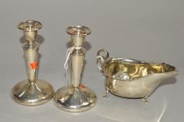 A PAIR OF ELIZABETH II SILVER DWARF CANDLESTICKS, conical stems to loaded circular bases, height