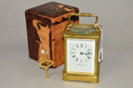 AN EARLY 20TH CENTURY BRASS CARRIAGE CLOCK, enamel dial with Roman numerals, names 'Jackman & Son,