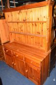 A PINE DRESSER with three drawers and a pine chest of three drawers (2)