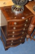 A SMALL REPRODUCTION MAHOGANY CHEST of six drawers
