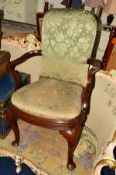 A VICTORIAN MAHOGANY ELBOW CHAIR on cabriole front legs and padded feet