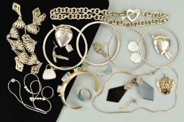 A SELECTION OF SILVER AND WHITE METAL JEWELLERY to include bangles, rings, pendants, necklaces,