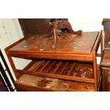 A TEAK FRAMED TILE TOPPED COFFEE TABLE