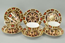 THREE ROYAL CROWN DERBY BREAKFAST CUPS AND SIX SAUCERS, together with another similar breakfast