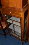 AN EDWARDIAN MAHOGANY AND INLAID GLAZED SINGLE DOOR DISPLAY CABINET (sd) and an oak three door hi fi