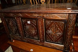 A 20TH CENTURY CARVED OAK TRIPLE PANEL BLANKET CHEST, width 91cm