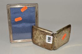 A GEORGE V SILVER CIGARETTE CASE OF BOWED SQUARE FORM, foliate engraved decoration and initialled,