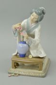 A LLADRO FIGURE, 'Geisha Girl arranging flowers' No4840, height 19cm (flower and stem missing and