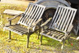 A PAIR OF BLACK PAINTED TEAK GARDEN FOLDABLE CHAIRS (2)