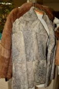 TWO CONEY FUR JACKETS, the first in brown is size 16, the second in grey is sized as 42