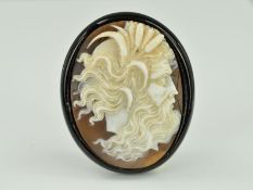 A LATE VICTORIAN JET CAMEO BROOCH, of oval outline, the cameo carved to depict a male god, length