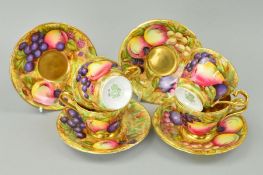 FOUR AYNSLEY 'ORCHARD GOLD' GILDED CABINET CUPS AND SAUCERS, signed N.Brunt, (three cups with