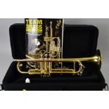 A CASED ARTEMIS CO BRASS TRUMPET, with music booklet