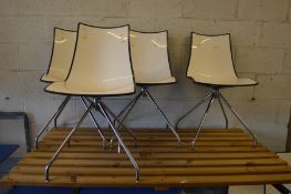 A SET OF FOUR SCAB DESIGN SWIVEL ZEBRA BILOCORE CHAIRS, white and black, raised on four chrome