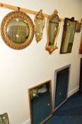 A LATE 19TH CENTURY ROSEWOOD FRAMED WALL MIRROR, a modern gilt wall mirror/shelf, a circular