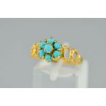 A 9CT GOLD TURQUOISE CLUSTER RING, designed as a tiered cluster of circular turquoise cabochons to