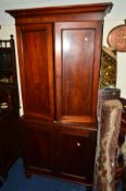 A LATE 19TH CENTURY MAHOGANY PANELLED FOUR DOOR CUPBOARD, width 101cm x depth 35cm x height 224cm