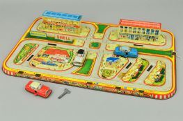 A LITHOGRAPHED TINPLATE CLOCKWORK CAR TRACK, multicoloured lithographed town centre scene, with