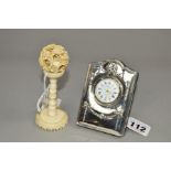A CARR'S SILVER MOUNTED EASEL BACK BEDSIDE TIME PIECE, Edwardian style ribbon and swag embossed