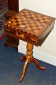A VICTORIAN MULTI WOOD GAMES/SEWING TRIPOD TABLE, the top inlaid with a chess table and the hinged