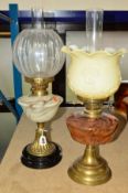 TWO BRASS OIL LAMPS, both with glass wells, funnels and shades, height tallest base 34cm (2)