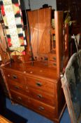AN EDWARDIAN PITCH PINE DRESSING TABLE with a triple mirror and eight various drawers, width 105cm