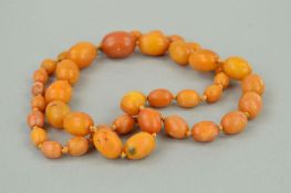 A NATURAL AMBER BEAD NECKLACE designed as a graduated bead necklace consisting of forty three barrel
