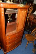 AN OAK DROP LEAF TABLE, three various chairs and a walnut two door cabinet (5)