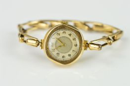 AN EARLY 20TH CENTURY 9CT GOLD LADIES WRISTWATCH, the circular face with Arabic numerals to the