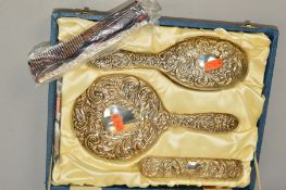 AN ELIZABETH II CASED SILVER FOUR PIECE DRESSING TABLE SET, comprising hand mirror, two brushes