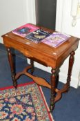 AN EDWARDIAN WALNUT, MAHOGANY AND INLAID SEWING TABLE, the hinged top with an inlaid twin handled