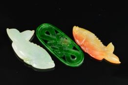 THREE PIECES OF CARVED JADEITE, to include two Koi Carp, one pale brown and one light green, each
