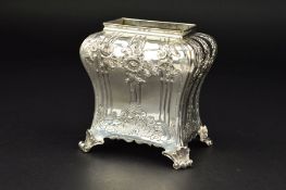 A GEORGE III SILVER TEA CADDY, of bombe form, lacks cover, chased floral sprays, vertical fluting