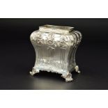 A GEORGE III SILVER TEA CADDY, of bombe form, lacks cover, chased floral sprays, vertical fluting