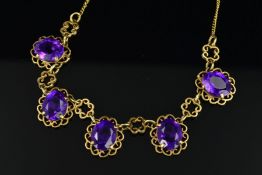 A MID TO LATE 20TH CENTURY AMETHYST FRINGE STYLE NECKLET, comprised of five oval mixed cut amethysts