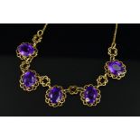 A MID TO LATE 20TH CENTURY AMETHYST FRINGE STYLE NECKLET, comprised of five oval mixed cut amethysts